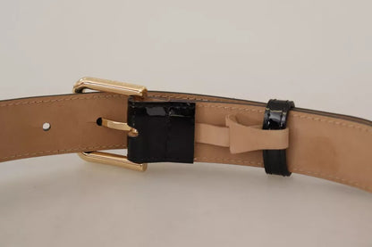 حزام دولتشي آند غابانا من الجلد الأسود مع مشبك معدني ذهبي محفور عليه شعار