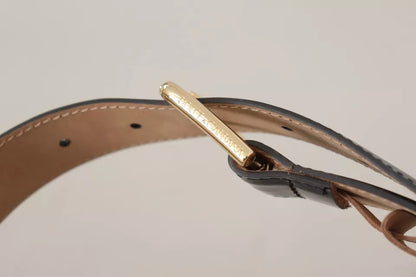 حزام دولتشي آند غابانا من الجلد الأسود مع مشبك معدني ذهبي محفور عليه شعار