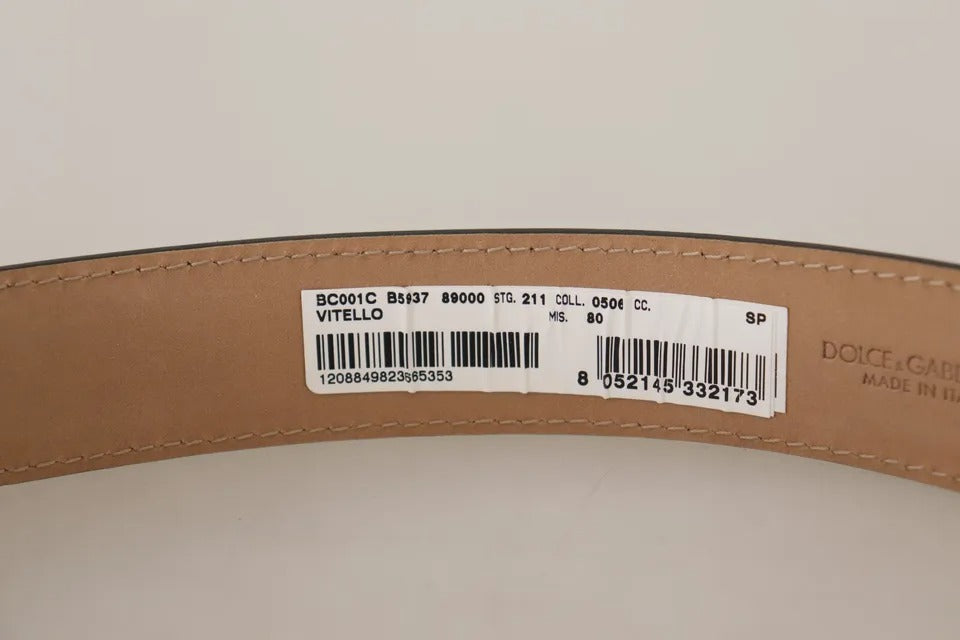 حزام دولتشي آند غابانا من الجلد الأسود مع مشبك معدني ذهبي محفور عليه شعار