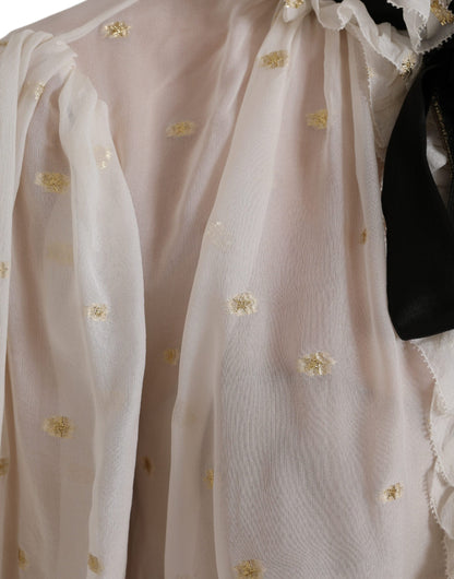 بلوزة دولتشي آند غابانا من مزيج الحرير باللون الأبيض الفاتح مع ياقة أسكوت