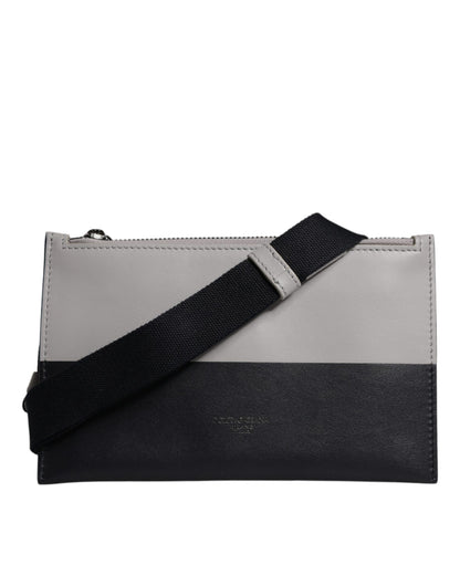 حقيبة كروس بودي من دولتشي آند غابانا، من الجلد الأسود والأبيض، منقوش عليها شعار دولتشي آند غابانا