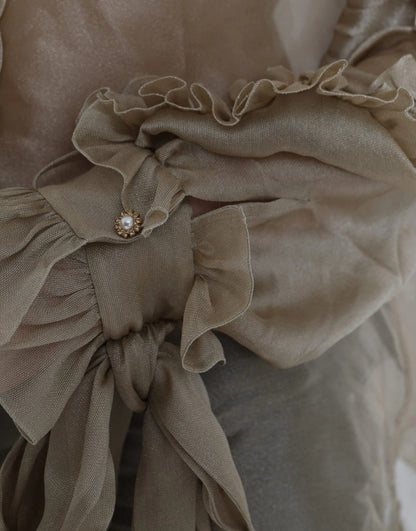 بلوزة دولتشي آند غابانا الذهبية بياقة أسكوت مزينة بالكشكشة