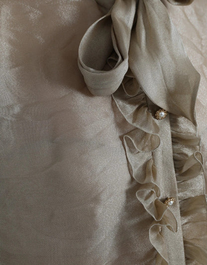 بلوزة دولتشي آند غابانا الذهبية بياقة أسكوت مزينة بالكشكشة