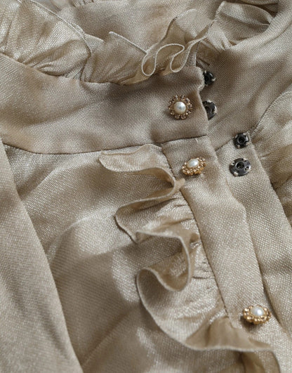 بلوزة دولتشي آند غابانا الذهبية بياقة أسكوت مزينة بالكشكشة