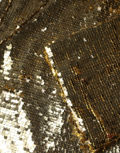 فستان دولتشي آند غابانا الذهبي المزين بالترتر بأكمام طويلة